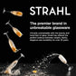 Advertisement for Strahl unbreakable glassware with glasses splashing on a black background.
