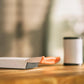 Small electronic device on a wooden surface with a blurred background