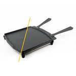 Black grill pan with handles on a white background